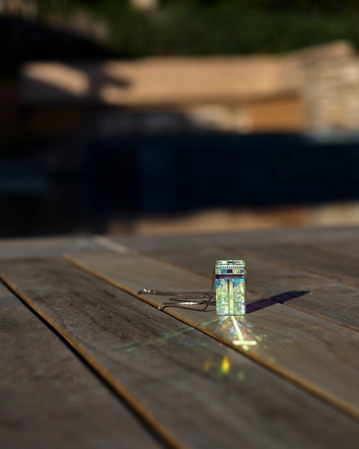 Cross Crystal Pendant Necklace reflecting sunlight